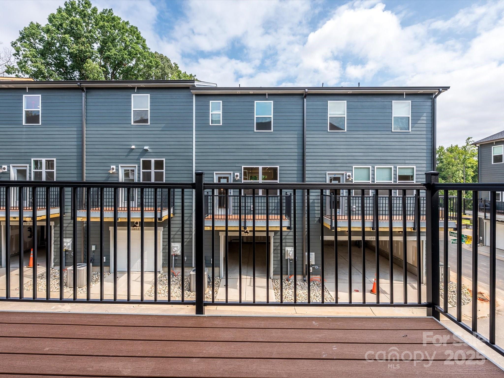 6009 Pivot Court Charlotte, NC 28205 - Photo 12 of 16 a view of a brick house with a small yard