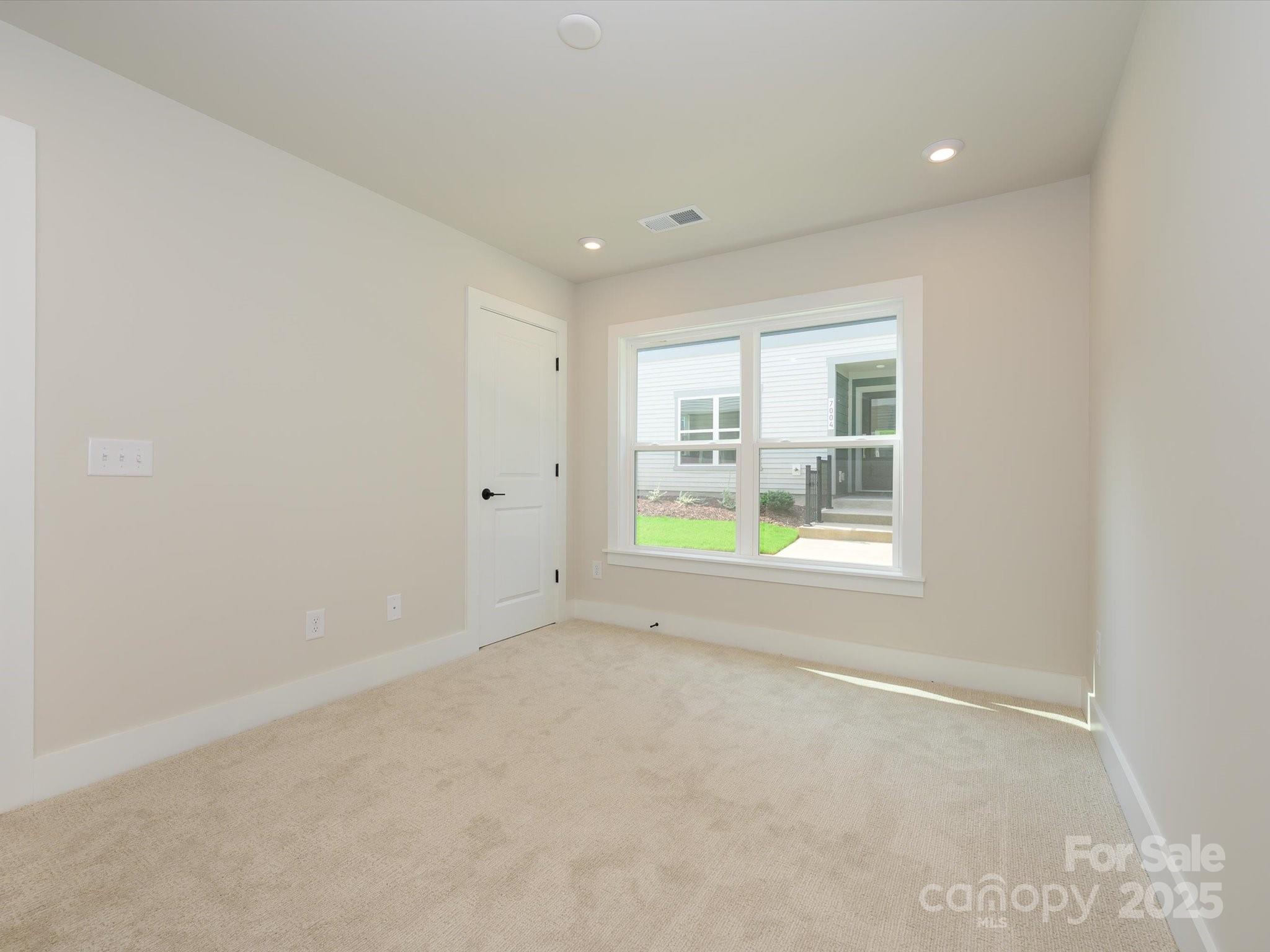 6009 Pivot Court Charlotte, NC 28205 - Photo 3 of 16 a view of an empty room with a window