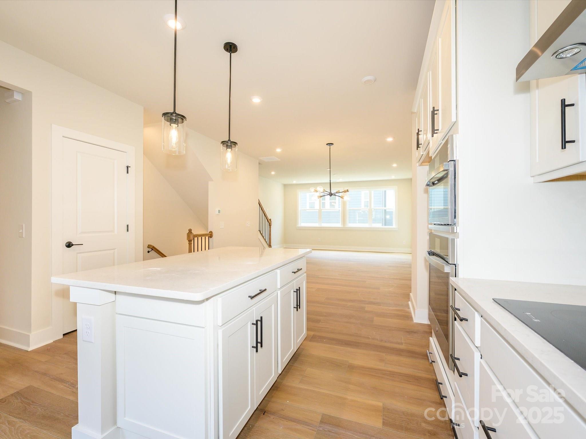 6009 Pivot Court Charlotte, NC 28205 - Photo 4 of 16 a bathroom with a sink a large mirror and a shower
