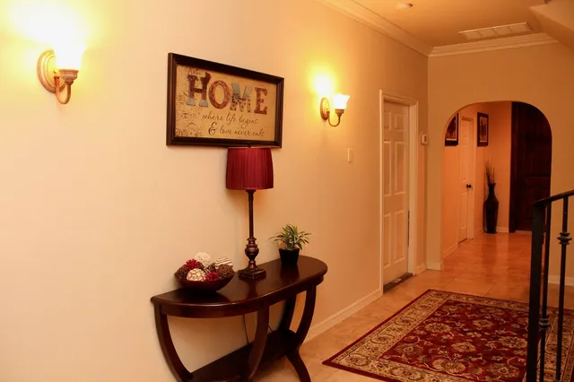 a lamp on a table in a bathroom
