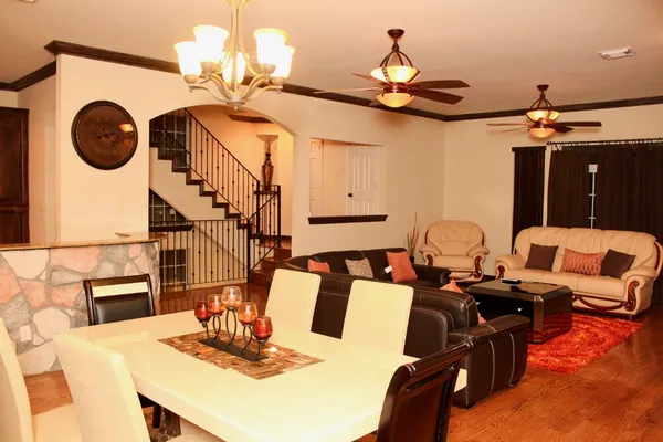 a very nice looking dining room with a table and chairs
