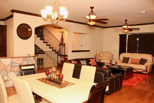 a very nice looking dining room with a table and chairs