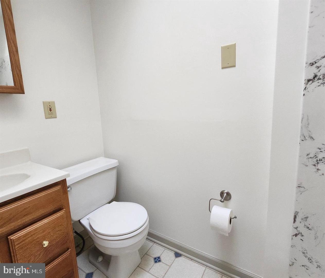 22 Wayne Avenue Trooper, PA 19403 - Photo 12 of 13 a white toilet sitting next to a bathroom sink