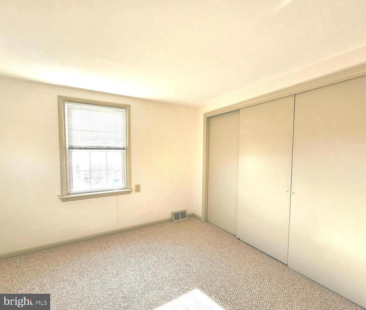 22 Wayne Avenue Trooper, PA 19403 - Photo 5 of 13 an empty room with a window
