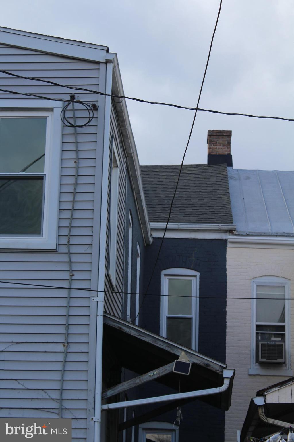 345 Pear Street Reading, PA 19601 - Photo 29 of 34 NEW ARCHITECHIAL SHINGLES ON PITCHED ROOF