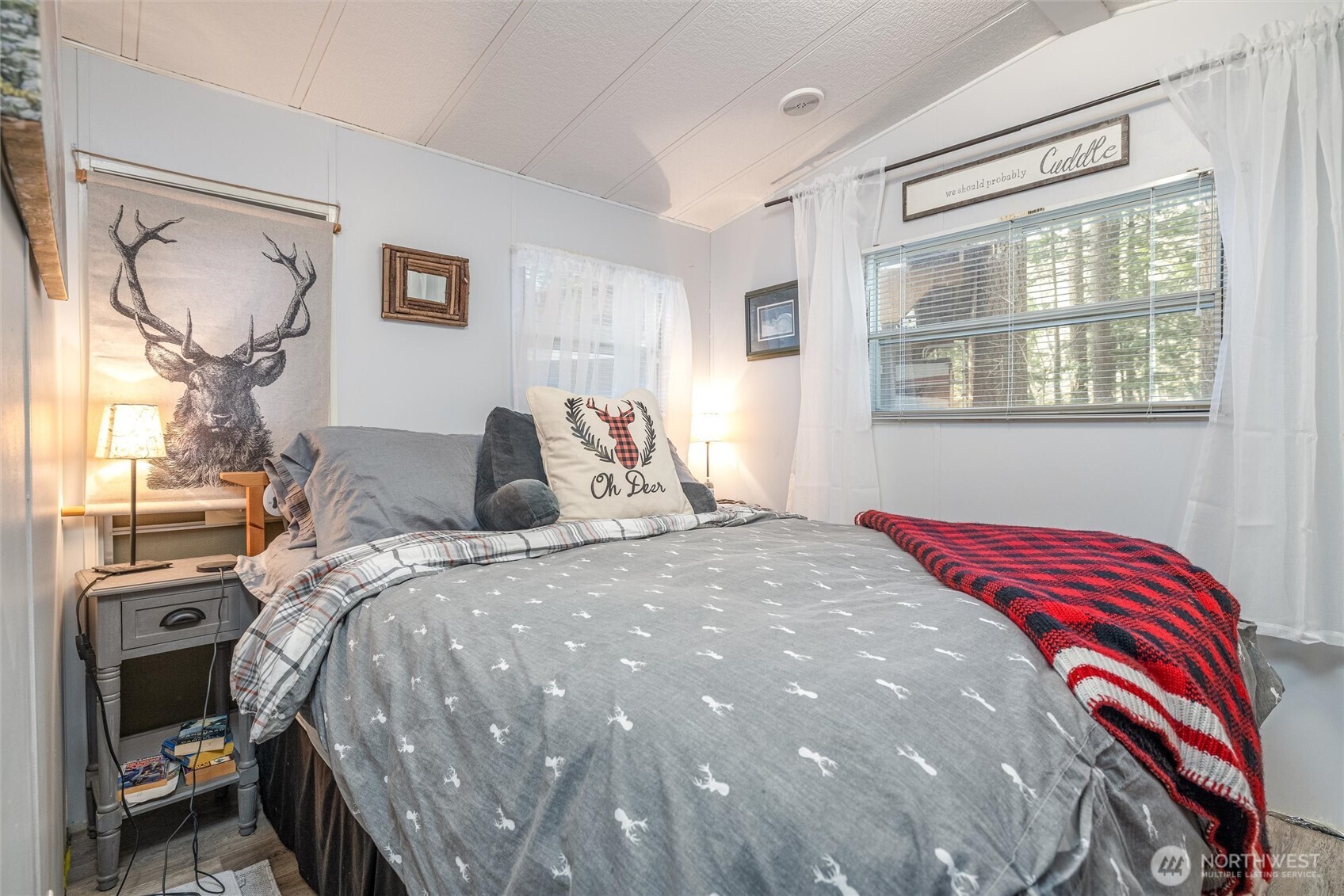 1075 Birch Lane Maple Falls, WA 98266 - Photo 12 of 16 a bedroom with a bed and wooden floor