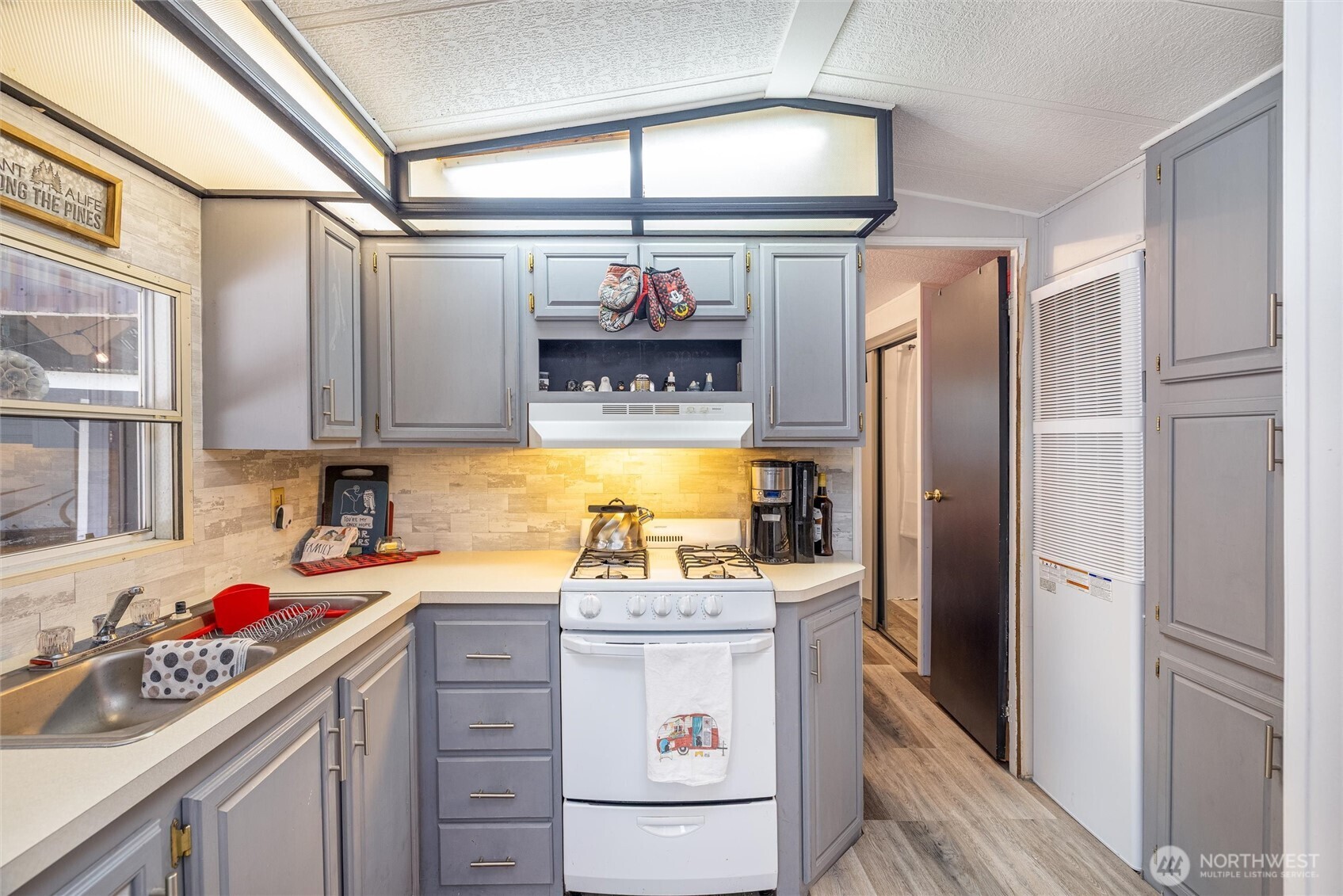 1075 Birch Lane Maple Falls, WA 98266 - Photo 5 of 16 a kitchen with a sink stove and refrigerator