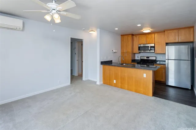 a kitchen with refrigerator and microwave