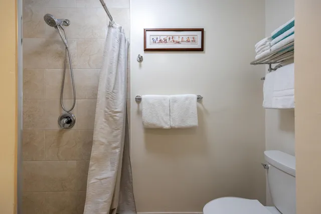 a bedroom with furniture and a chandelier