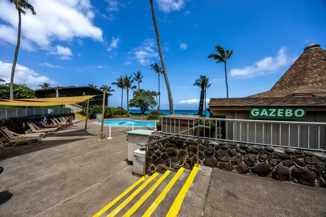 a view of a swimming pool with a yard