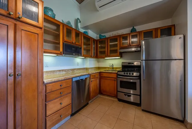 a dining room with a kitchen table and chairs