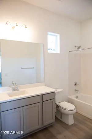 a bathroom with a sink a toilet and a bathtub