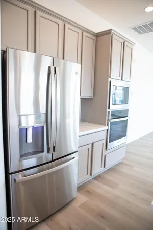 a kitchen with stainless steel appliances a refrigerator and a sink