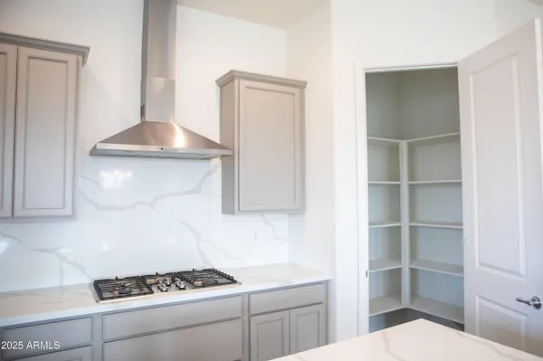 a kitchen with a cabinets and stove