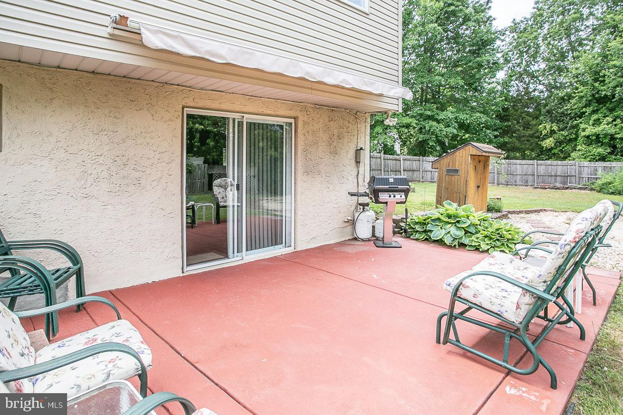 107 Level Road Collegeville, PA 19426 - Photo 35 of 39 Rear patio with sliders to the recreation room