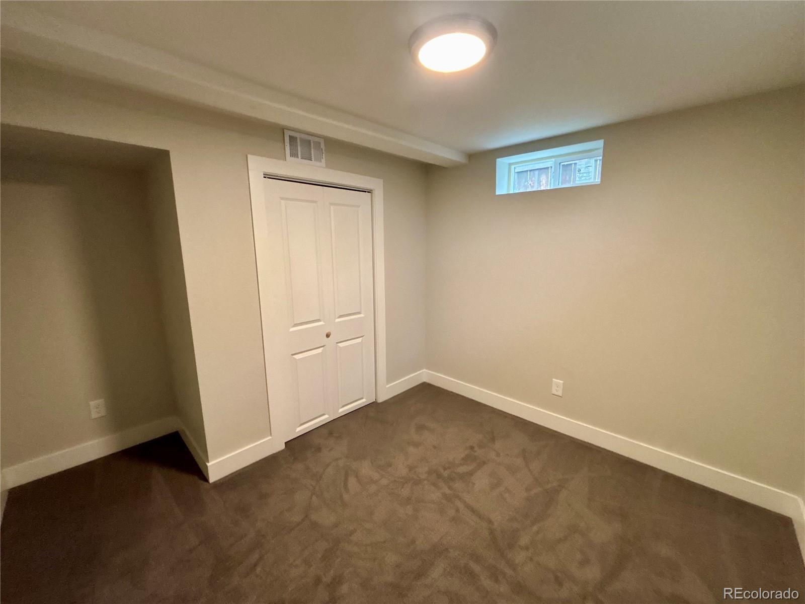 4420 Teller Street Wheat Ridge, CO 80033 - Photo 14 of 20 an empty room with a door