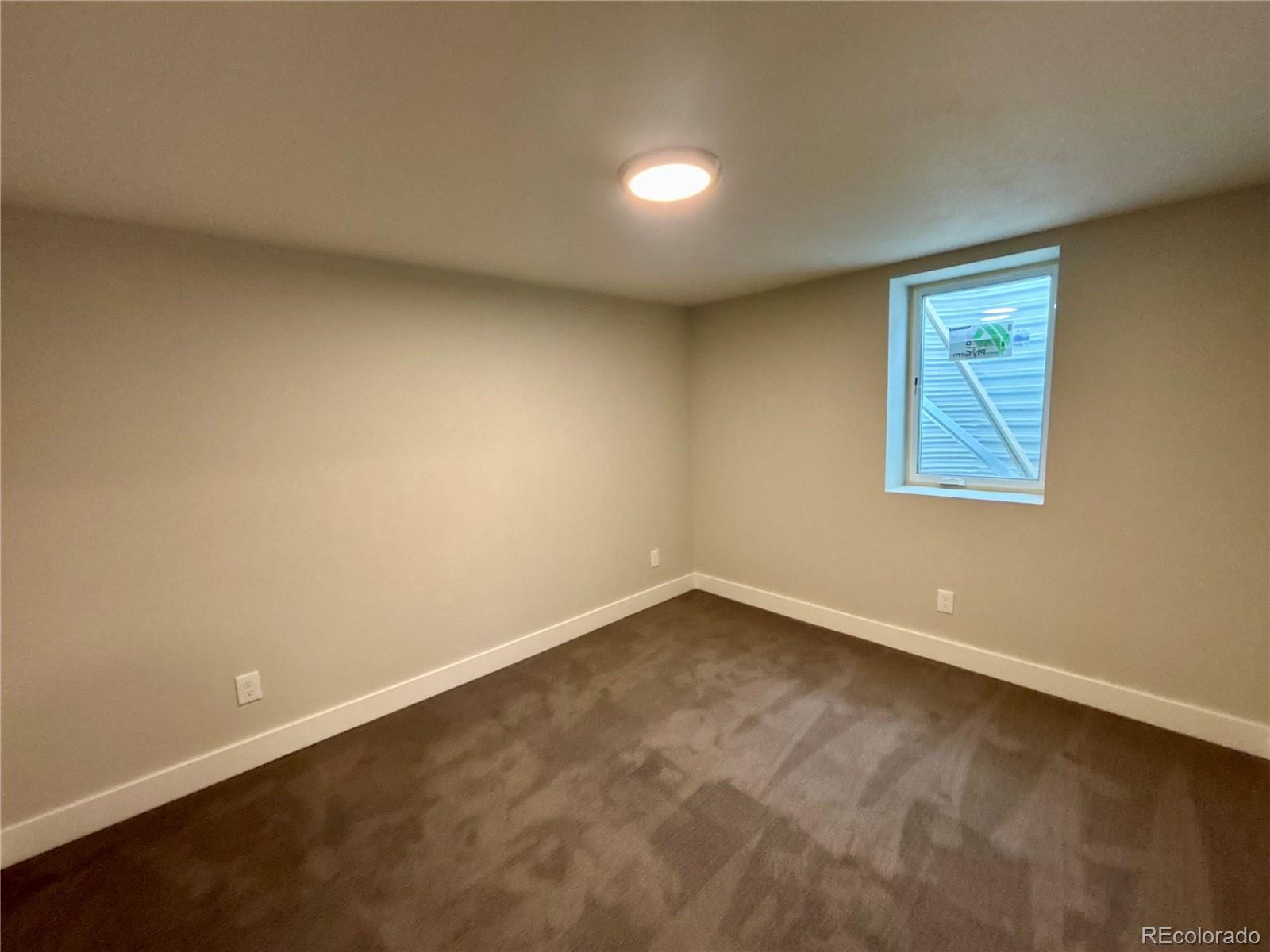 4420 Teller Street Wheat Ridge, CO 80033 - Photo 16 of 20 an empty room with a workbench