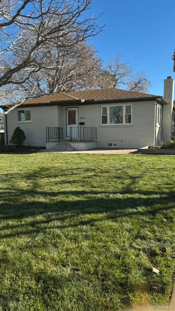 4420 Teller Street Wheat Ridge, CO 80033 - Photo 20 of 20 a view of a house with a yard
