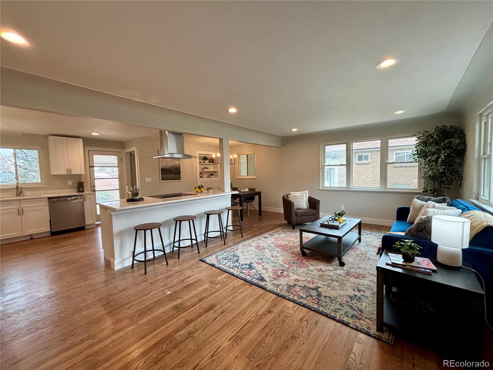4420 Teller Street Wheat Ridge, CO 80033 - Photo 2 of 20 a living room with furniture and a wooden floor