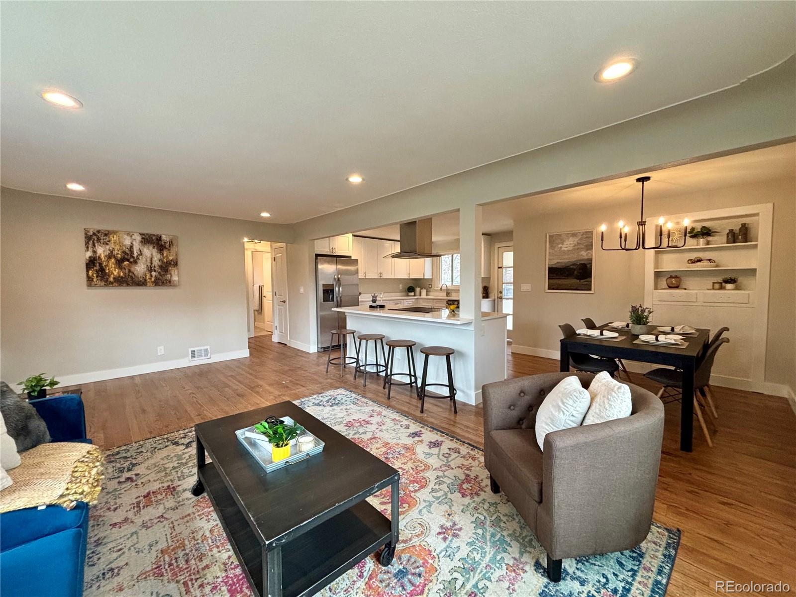 4420 Teller Street Wheat Ridge, CO 80033 - Photo 3 of 20 a living room with furniture and a wooden floor