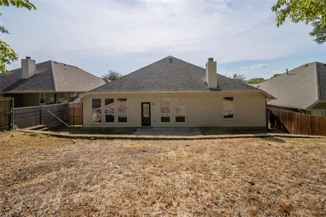 a house with trees in the background