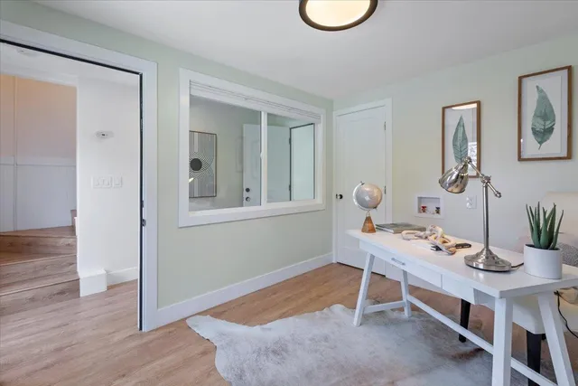 a workspace with furniture and window