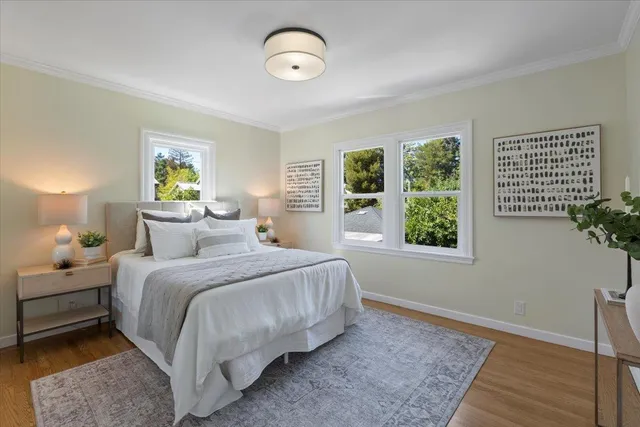 a bedroom with bed and a window