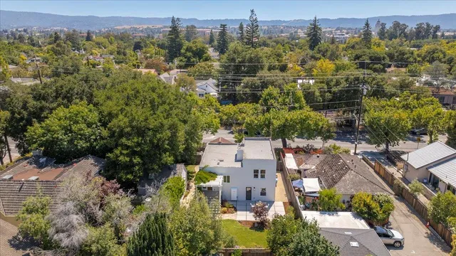 an aerial view of a house with yard