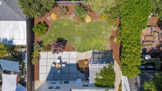 an aerial view of a house with a yard