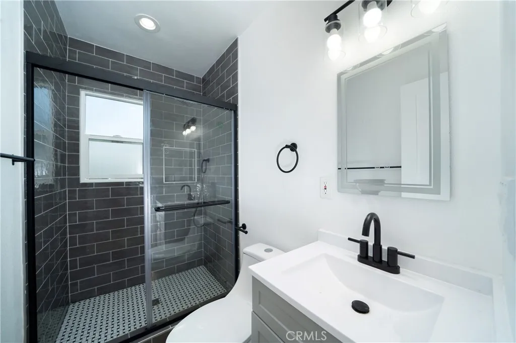 1050 Cedar Avenue Long Beach, CA 90813 - Photo 8 of 8 a bathroom with a sink a toilet and shower