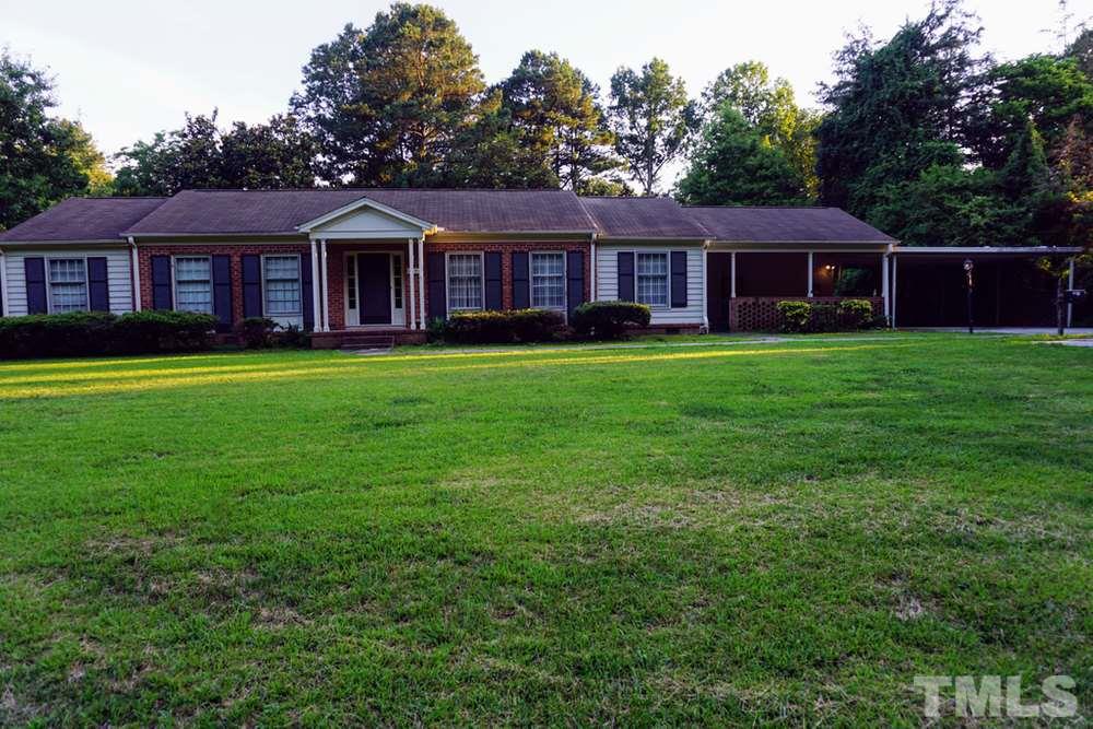 2511 West Cornwallis Road Durham, NC 27705 - Photo 26 of 27 2511 W Cornwallis with view of carport and large front yard.