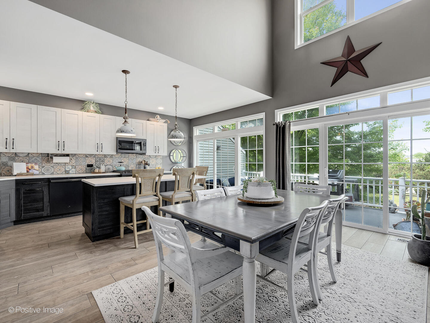 1016 Hummingbird Way Bartlett, IL 60103 - Photo 11 of 41 a kitchen with kitchen island granite countertop a table and chairs in it