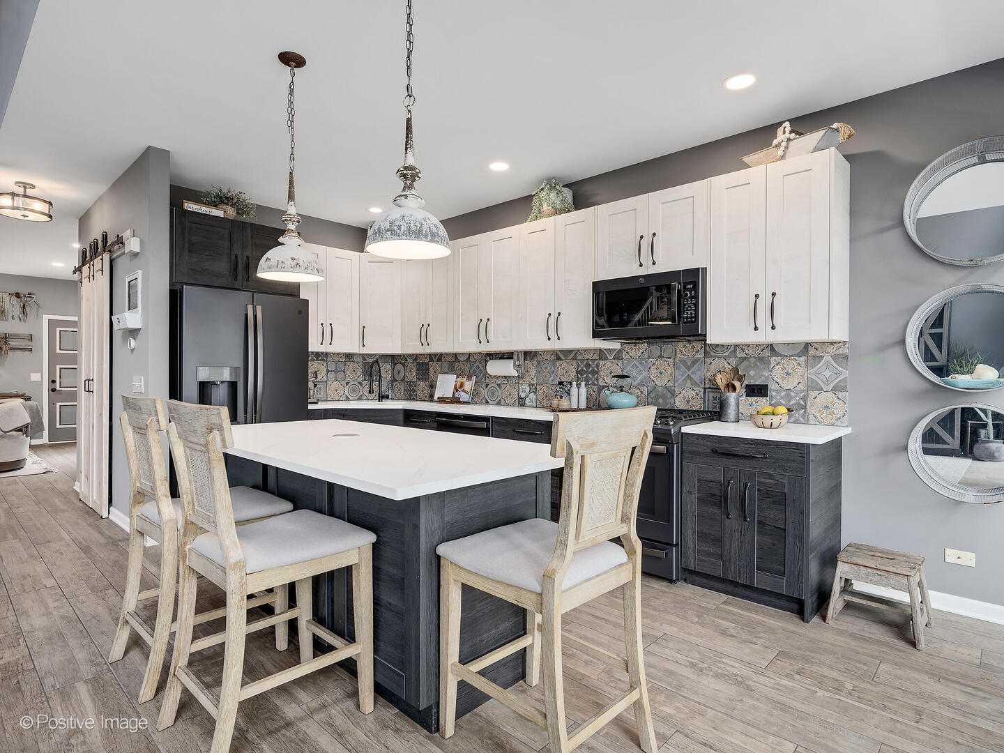 1016 Hummingbird Way Bartlett, IL 60103 - Photo 13 of 41 a kitchen with a dining table chairs sink and cabinets