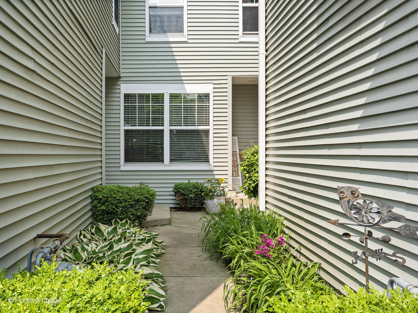 1016 Hummingbird Way Bartlett, IL 60103 - Photo 2 of 41 a view of a house with a flower and a pathway