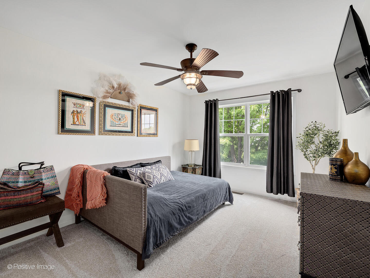 1016 Hummingbird Way Bartlett, IL 60103 - Photo 29 of 41 a bedroom with a bed gym equipment and a large window