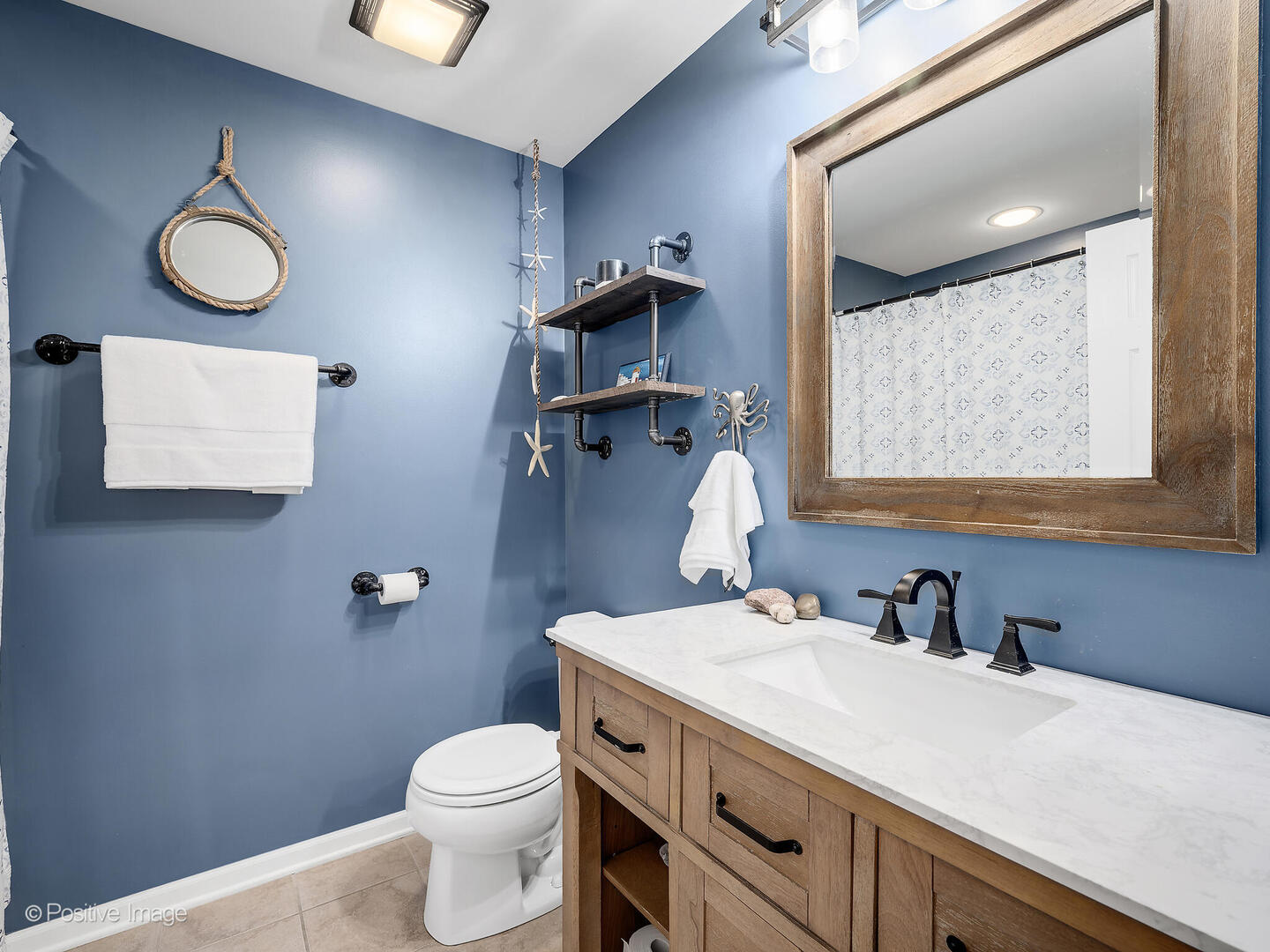 1016 Hummingbird Way Bartlett, IL 60103 - Photo 30 of 41 a bathroom with a granite countertop toilet sink and mirror