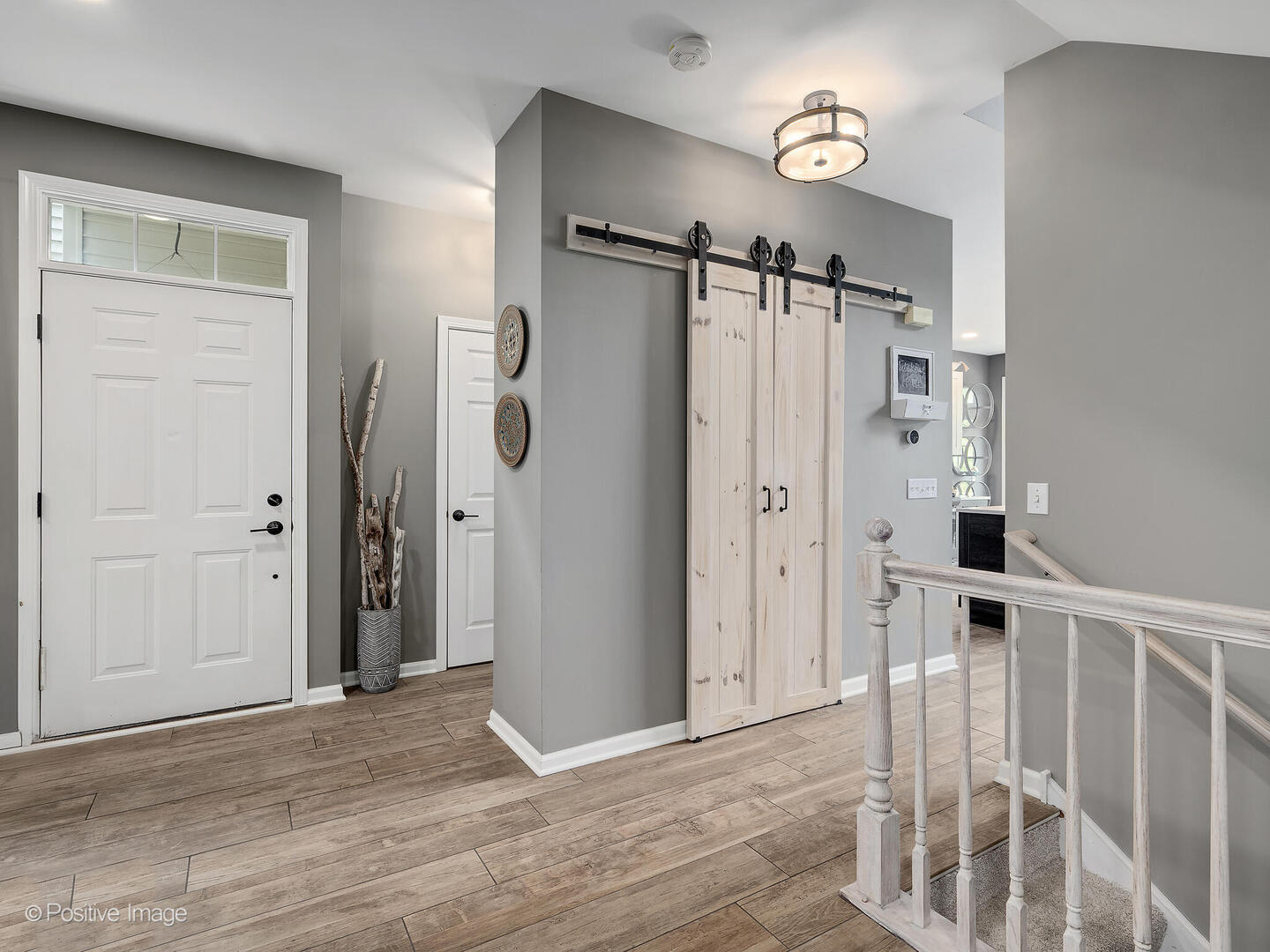 1016 Hummingbird Way Bartlett, IL 60103 - Photo 7 of 41 a view of a hallway with wooden floor and entryway