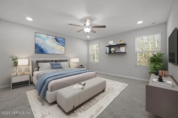 an empty room with windows and fan