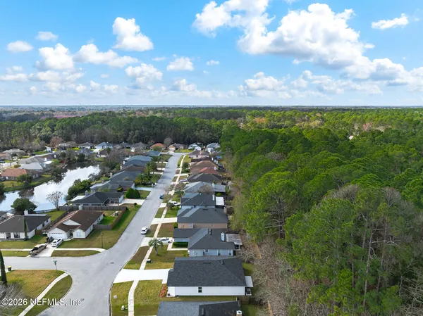 an aerial view of residential houses with outdoor space