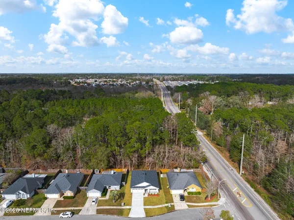 an aerial view of residential house with outdoor space and parking