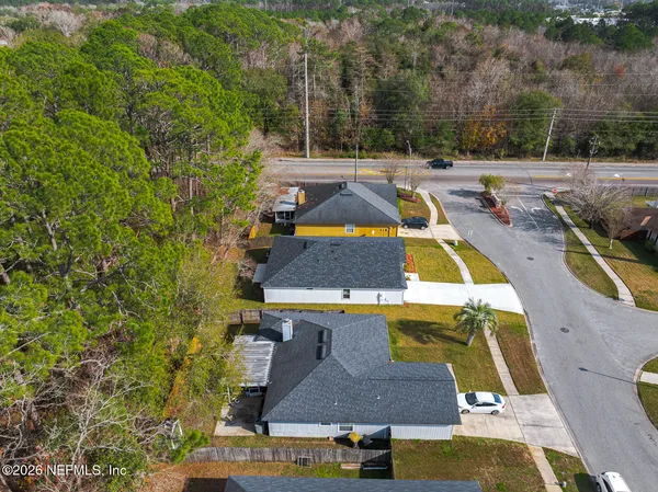 an aerial view of a house with swimming pool