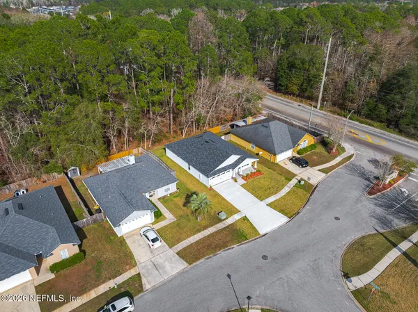 an aerial view of a house with swimming pool