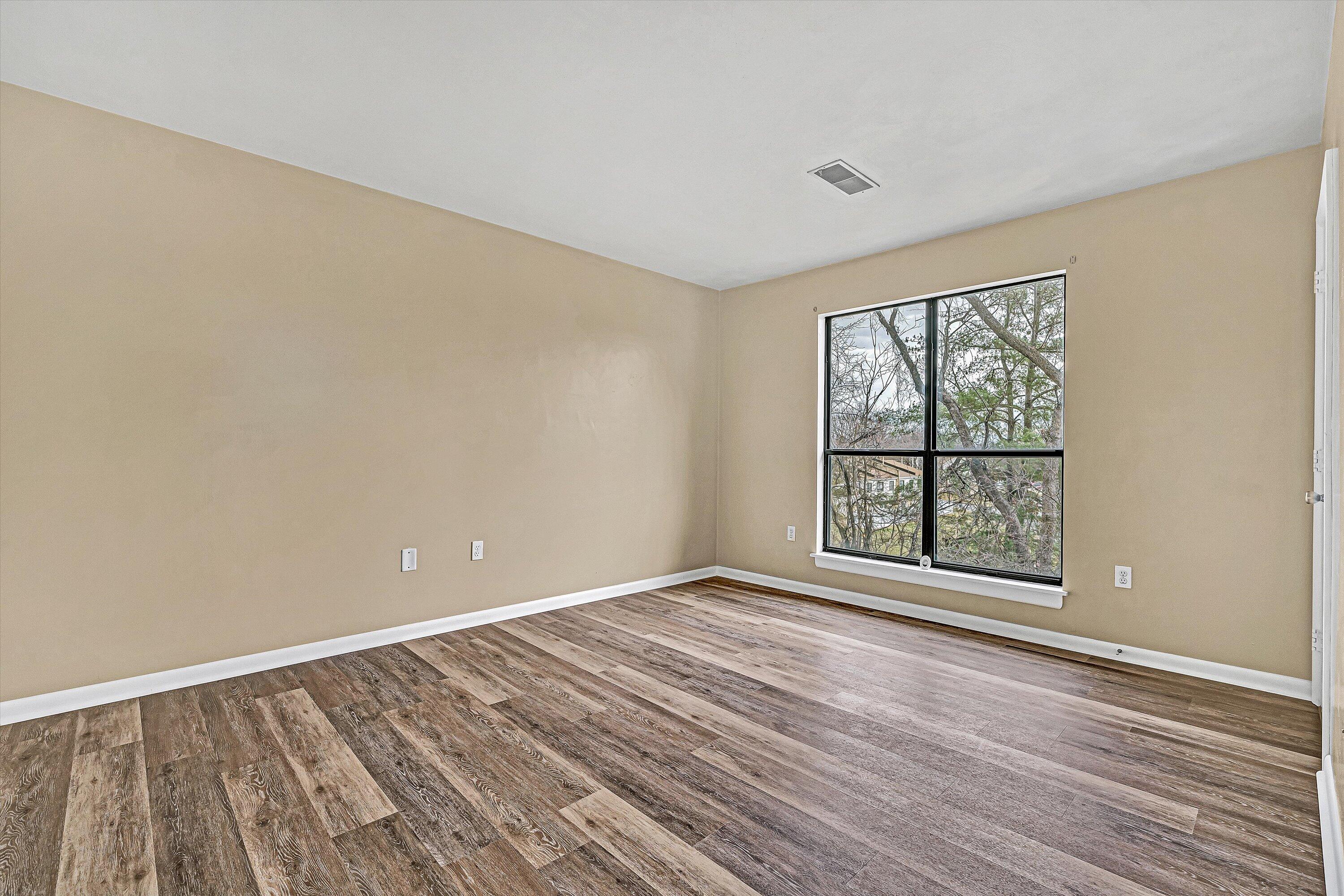 3522 Timberline Trail Roanoke, VA 24018 - Photo 15 of 21 a view of an empty room with a window and wooden floor