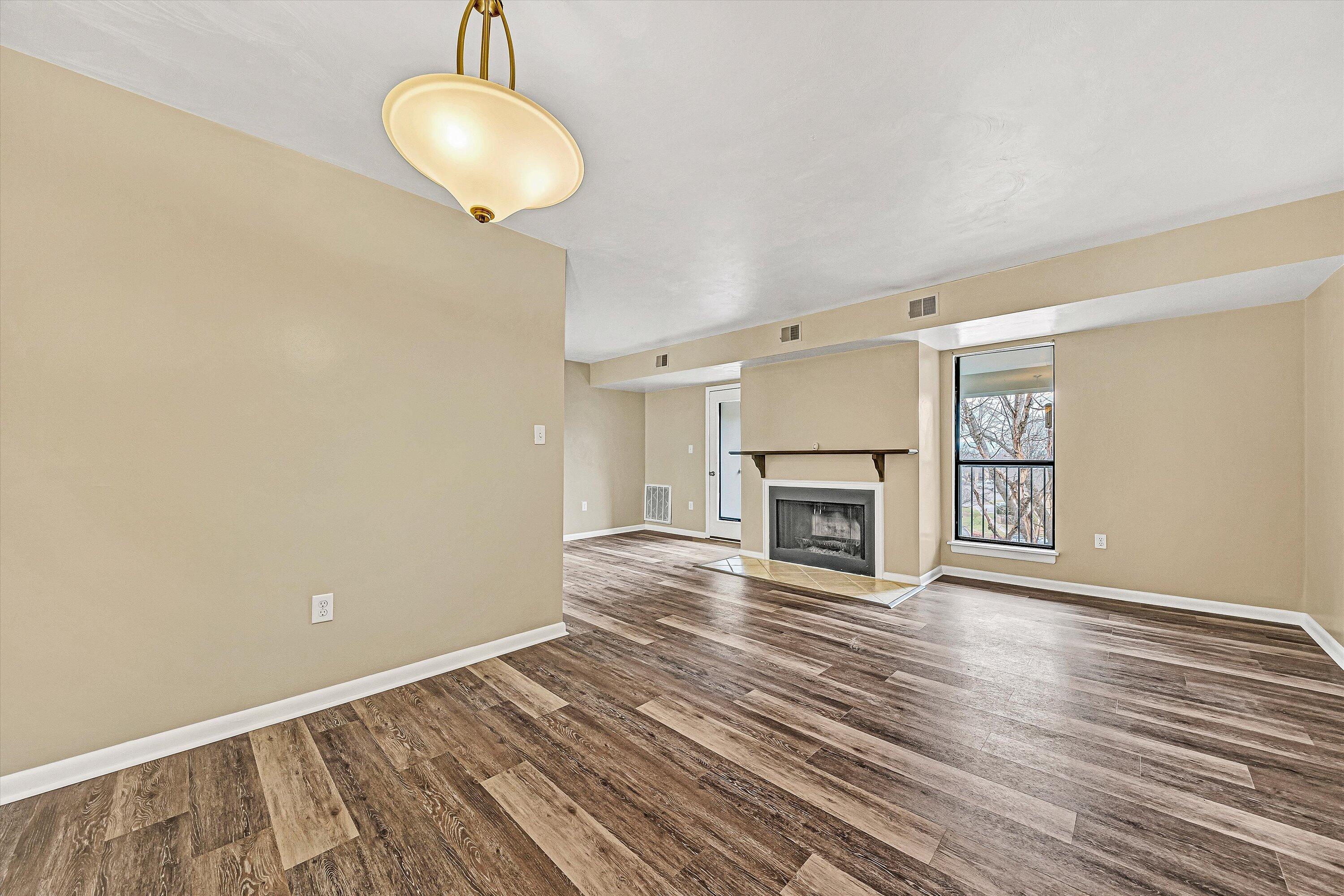 3522 Timberline Trail Roanoke, VA 24018 - Photo 7 of 21 a view of empty room with wooden floor and fireplace