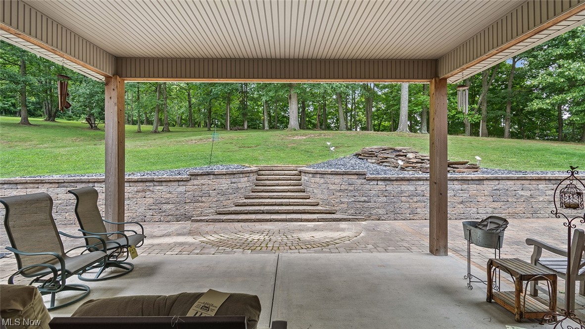 57430 Ohio Riverview Road Shadyside, OH 43947 - Photo 24 of 35 View of patio featuring an outdoor firepit