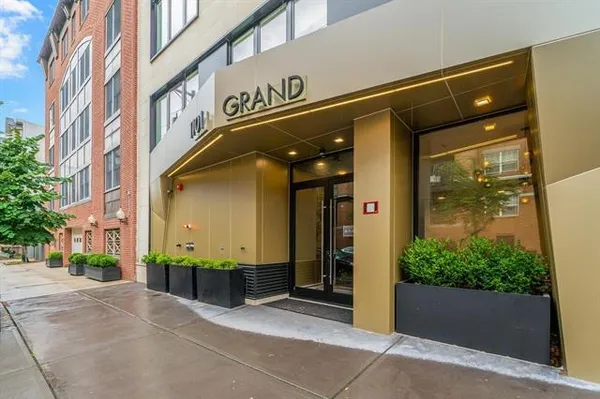 a view of a building with potted plants