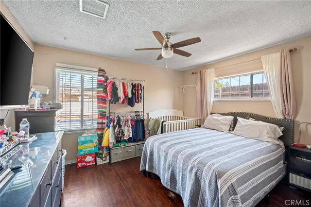 a bedroom with a bed furniture and a window