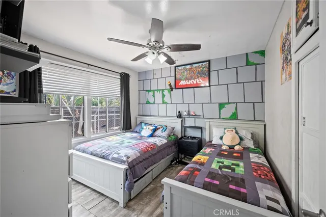 a bedroom with bed and a window