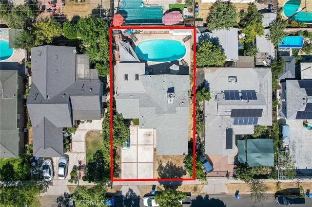 an aerial view of a house with a yard