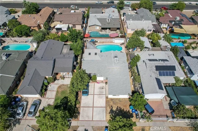 an aerial view of residential house with yard